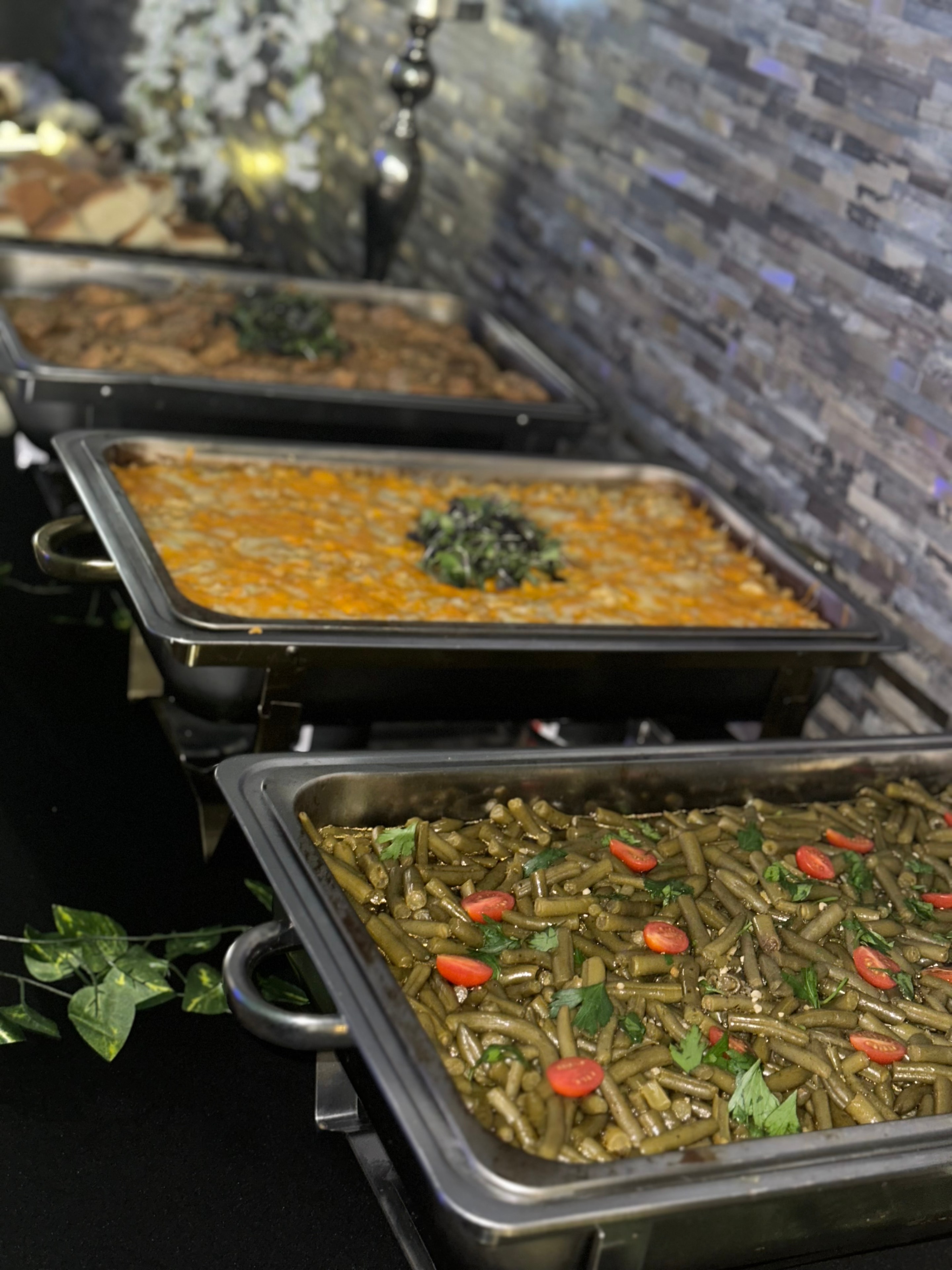 Catering service trays with seasoned chicken and sides