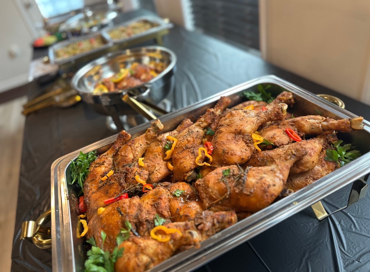 Seasoned meat dishes in catering trays