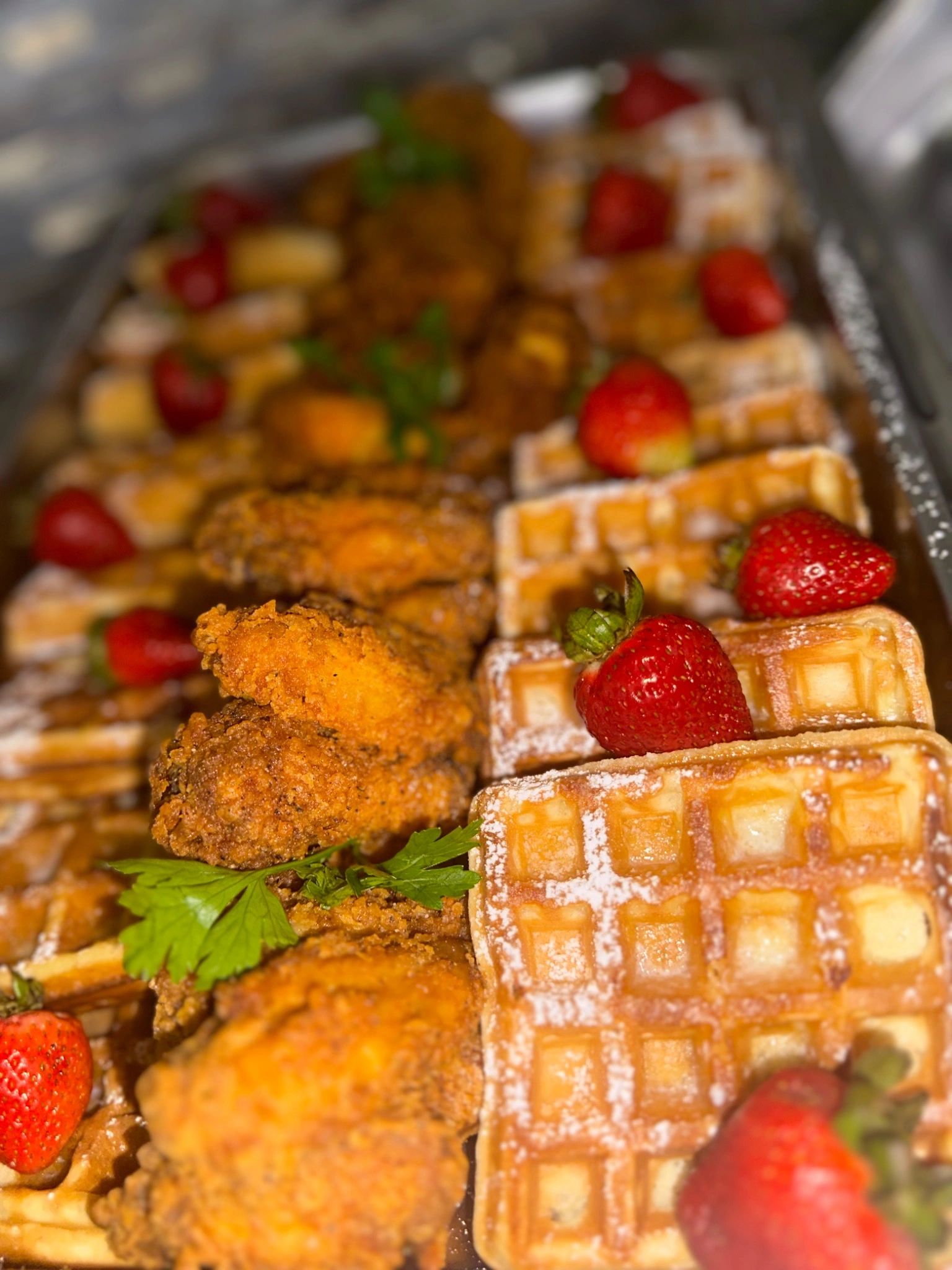 Waffles with strawberries and powdered sugar