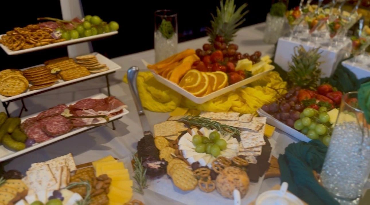 Elegant catering spread with charcuterie and fruits